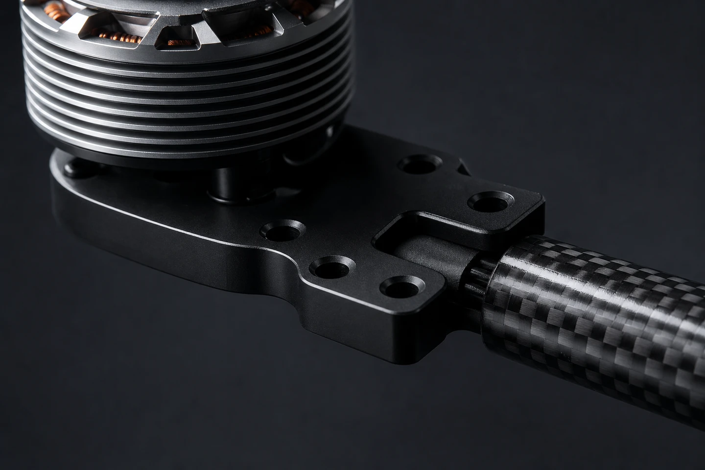 CNC-machined aluminum motor mount on a carbon-fiber drone arm